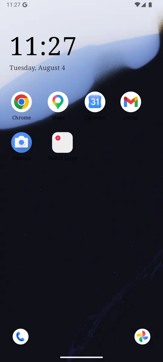 ReClaim home screen with a large clock, the date, a short row of chosen apps, and Phone and Photos shortcuts in the bottom corners